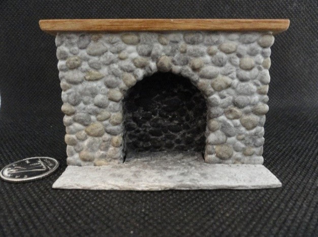 River Rock Arched fireplace

1:24 River rock fireplace with arched opening, hearth included. 1-7/8" h at mantel top x 2-15/16" w. Interior chimney sold separately. Supplied unpainted in grey, with finishing tips.